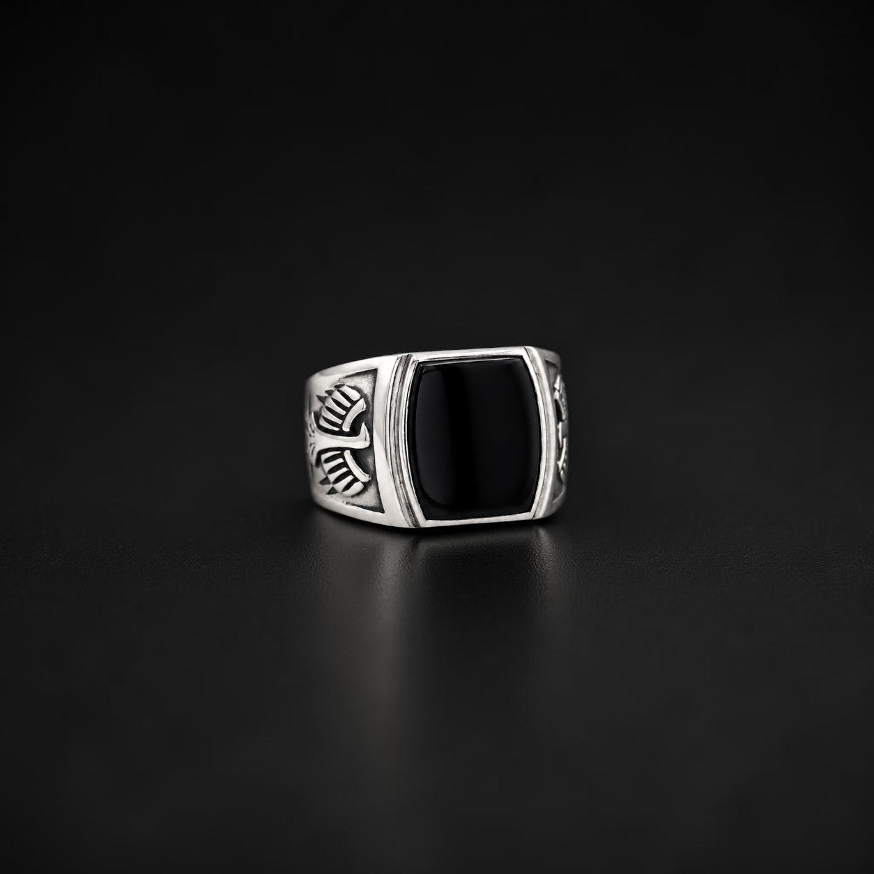 ZIVORI men's signet ring in 925 sterling silver featuring a polished black onyx stone and detailed side engravings.