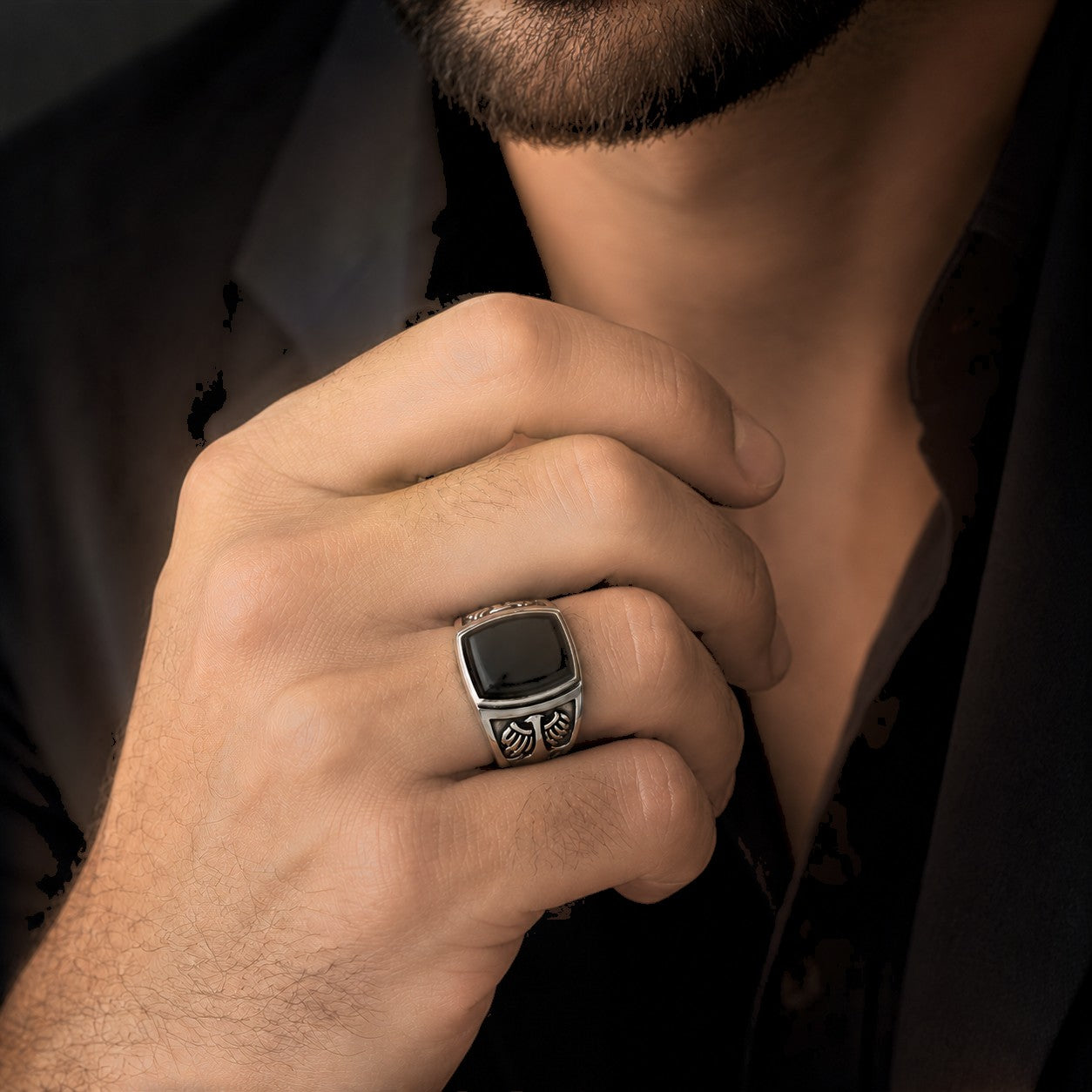 ZIVORI men's sterling silver signet ring featuring a polished black onyx stone and intricate engraved side detailing.