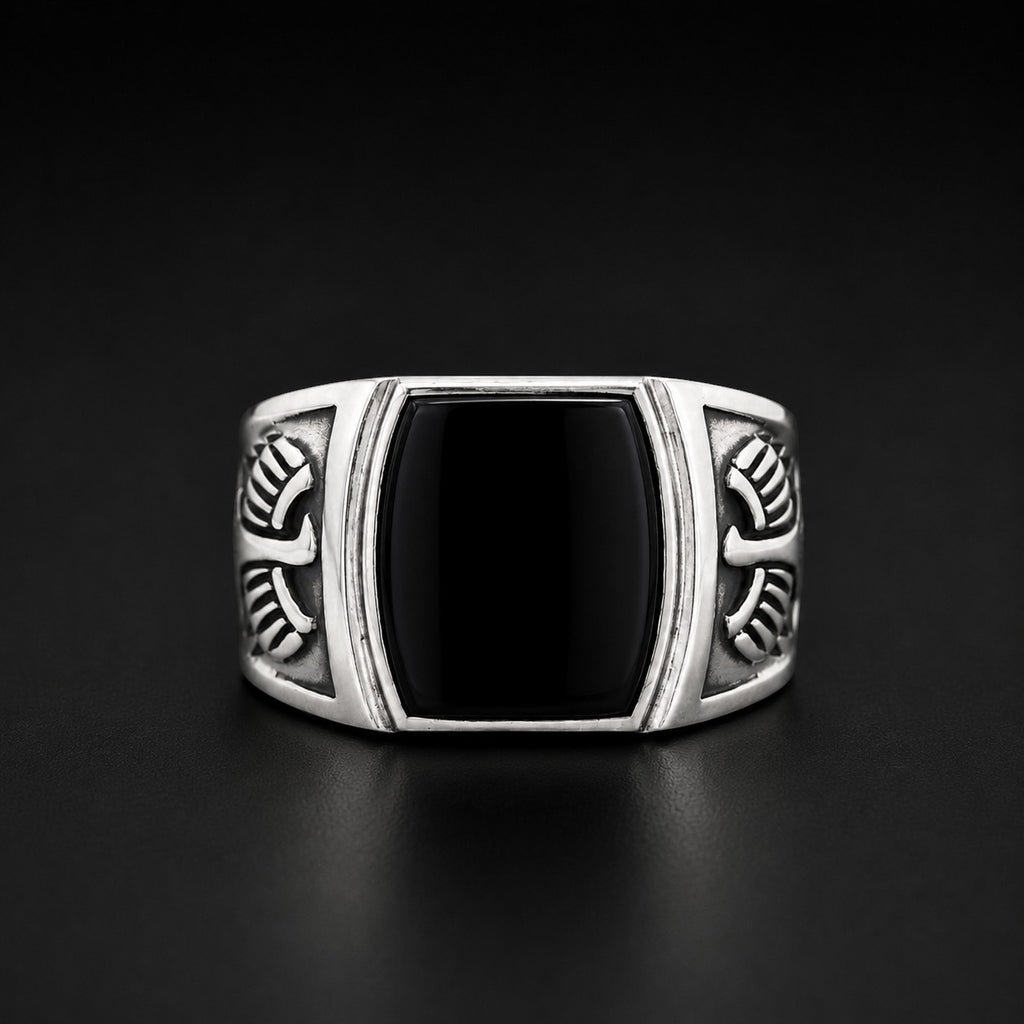 ZIVORI sterling silver signet ring featuring a polished black onyx stone and intricate engraved wing side details.