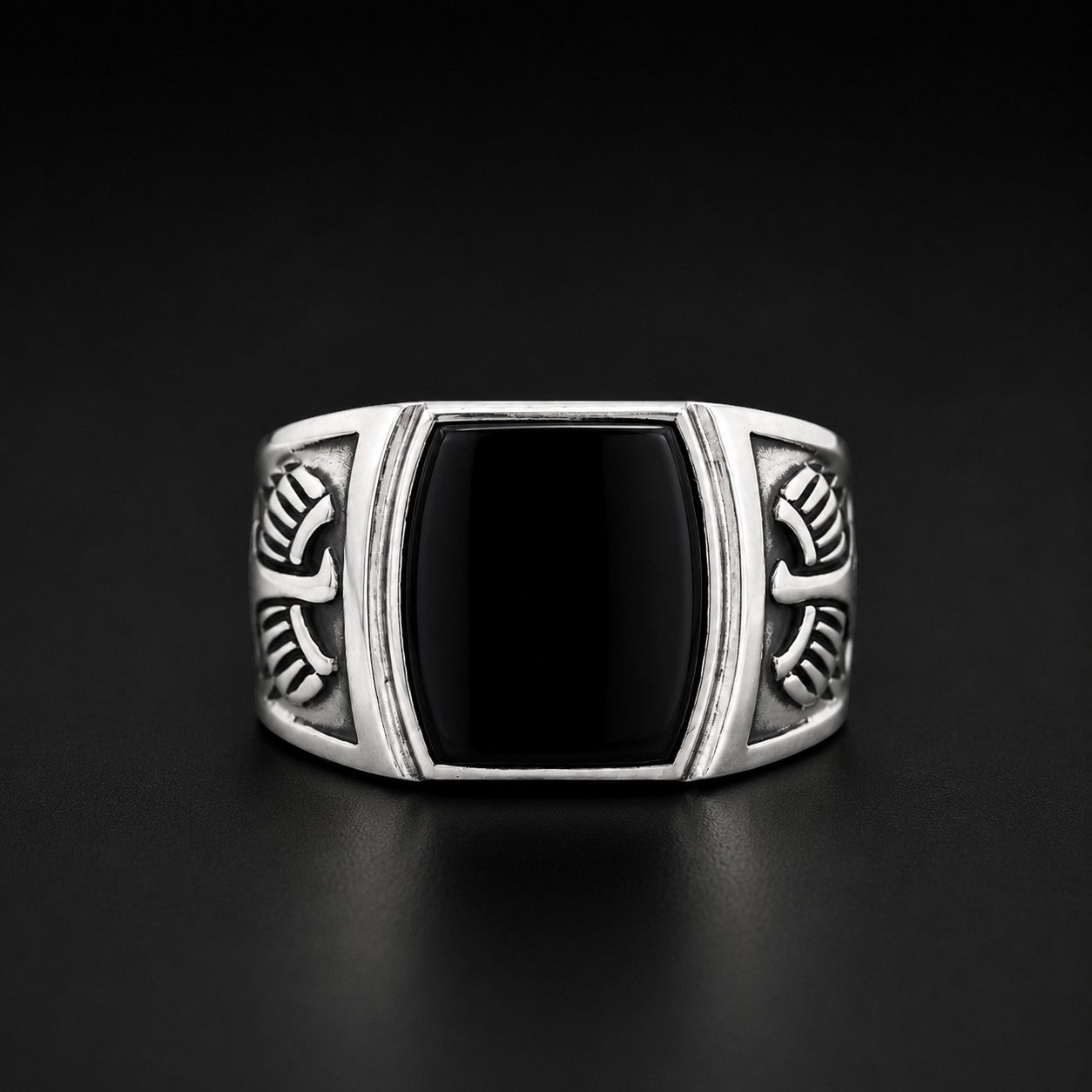 ZIVORI sterling silver signet ring featuring a polished black onyx stone and intricate engraved wing side details.