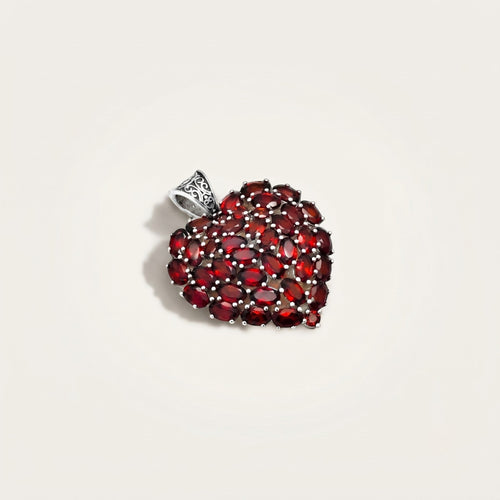 ZIVORI heart pendant featuring a cluster of oval-cut red garnet gemstones set in 925 sterling silver with filigree.