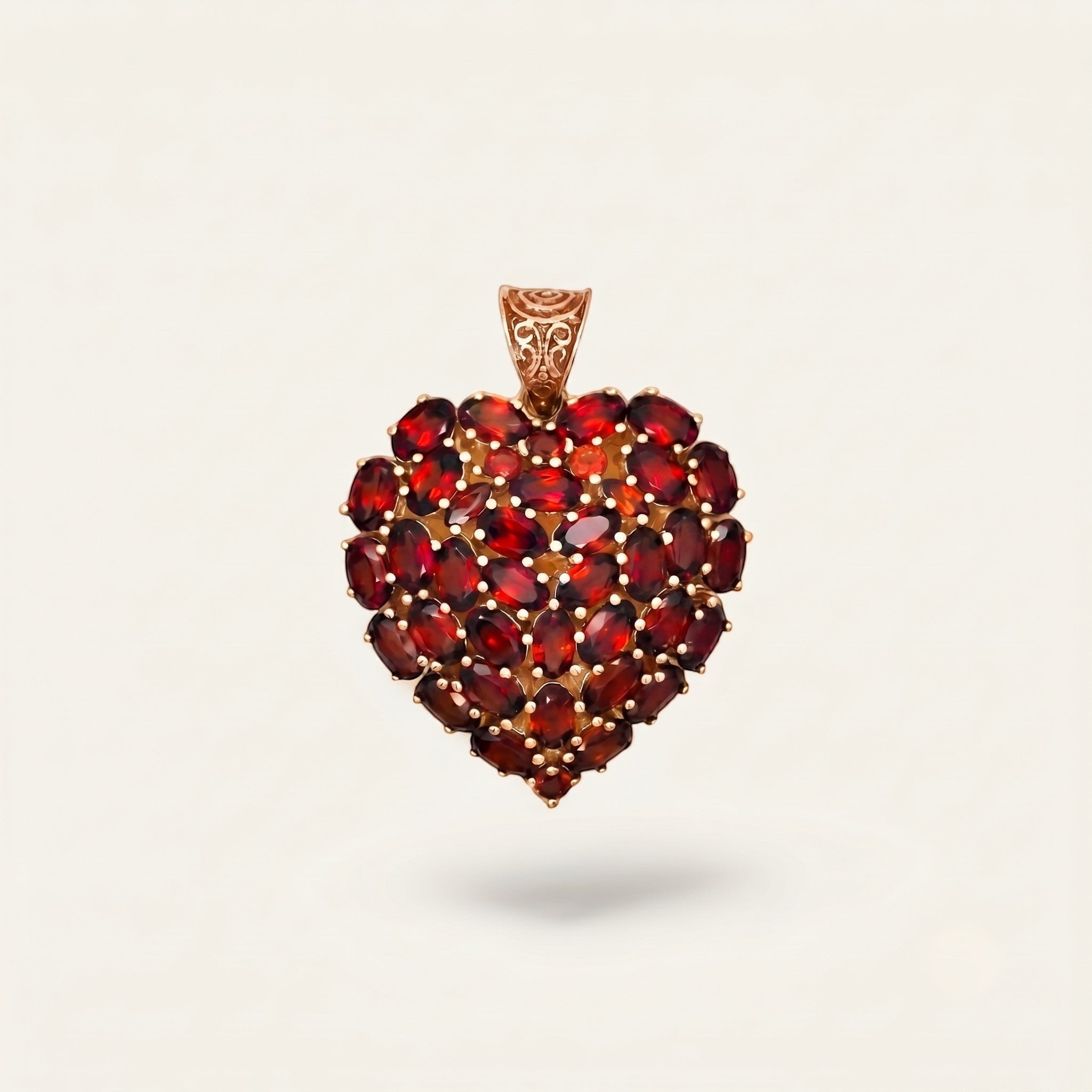 ZIVORI heart pendant featuring a cluster of oval-cut natural red garnets set in 925 sterling silver with filigree bail