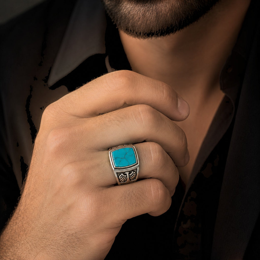 ZIVORI men's sterling silver signet ring featuring a natural turquoise stone and intricate eagle wing detailing.