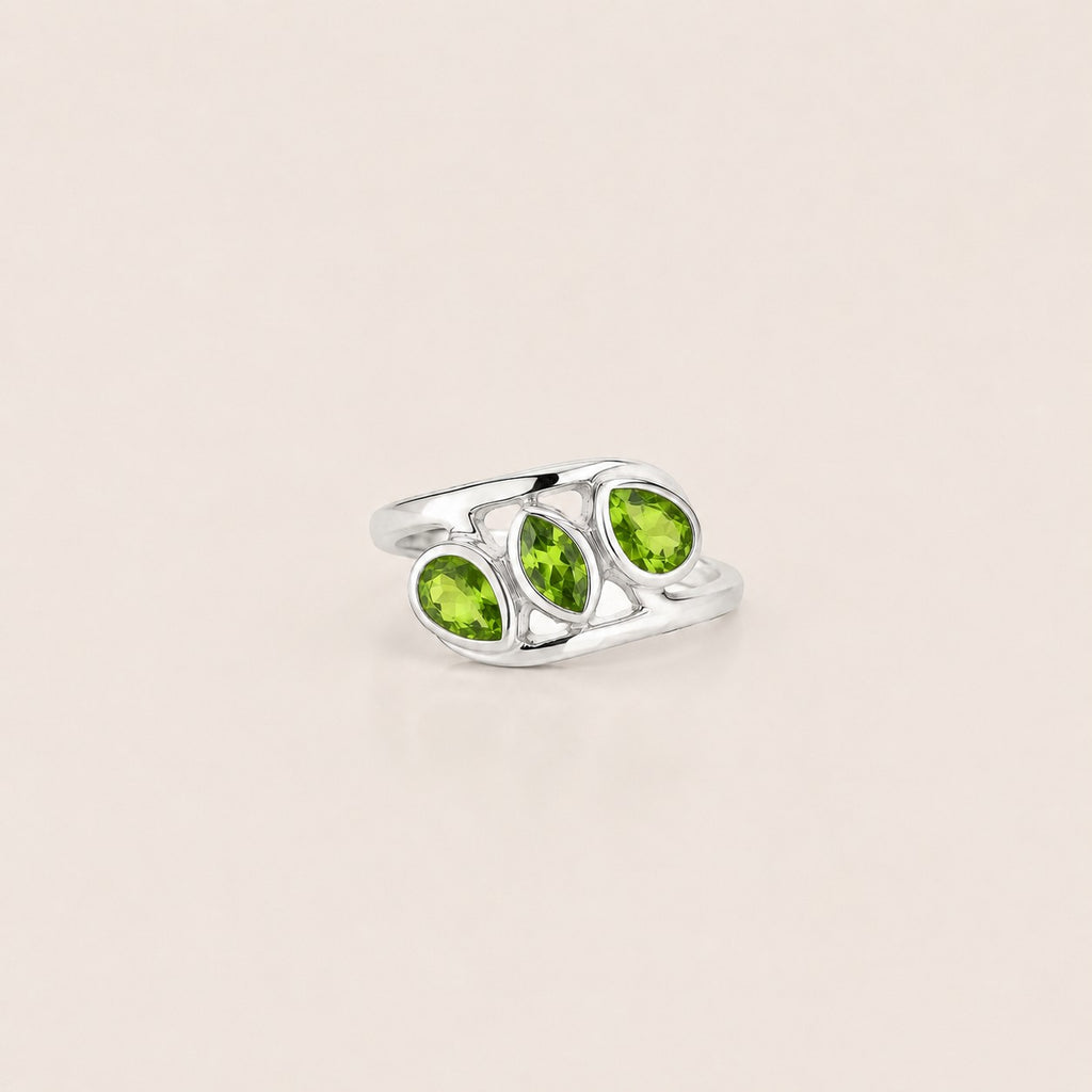 ZIVORI Verdant Trilogy ring featuring three natural peridot stones set in polished 925 sterling silver curves.