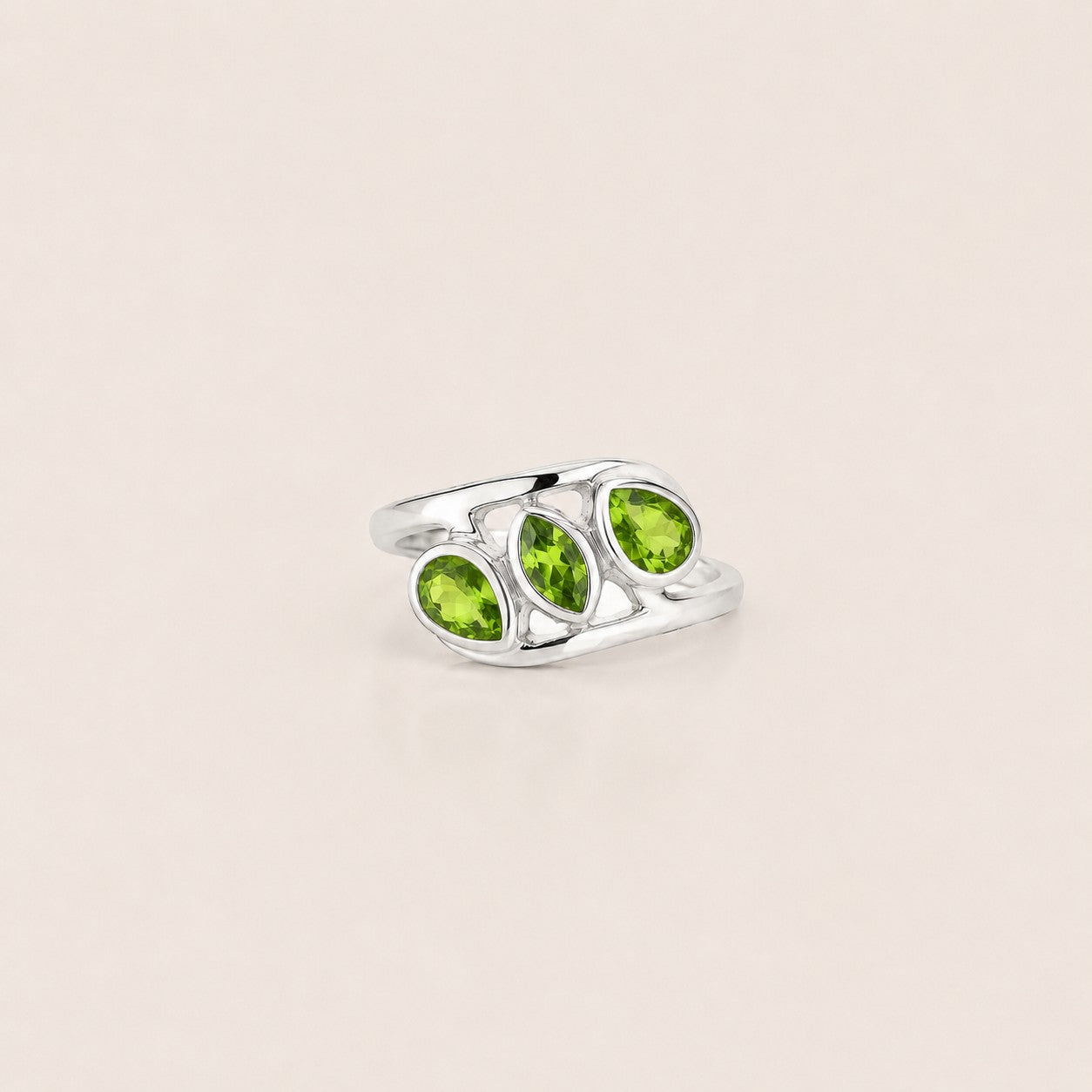 ZIVORI Verdant Trilogy ring featuring three natural peridot stones set in polished 925 sterling silver curves.