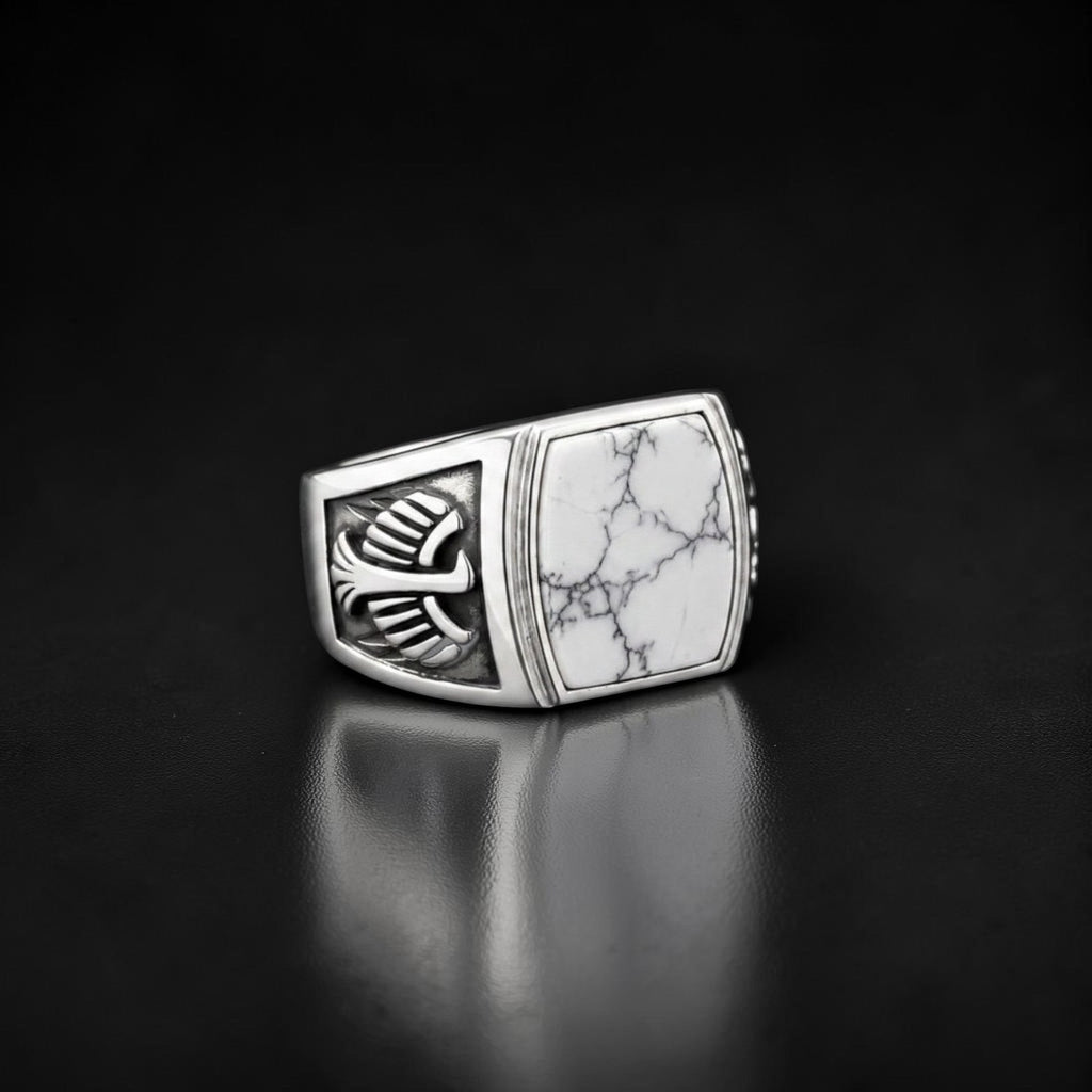 ZIVORI men's signet ring in 925 sterling silver featuring a white howlite stone with intricate wing side detailing.