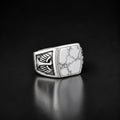 ZIVORI men's signet ring in 925 sterling silver featuring a white howlite stone with intricate wing side detailing.