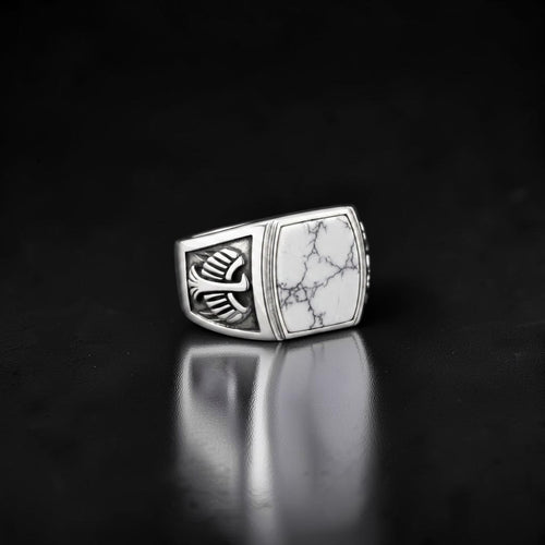 ZIVORI men's signet ring in 925 sterling silver featuring a white howlite stone with intricate wing side detailing.