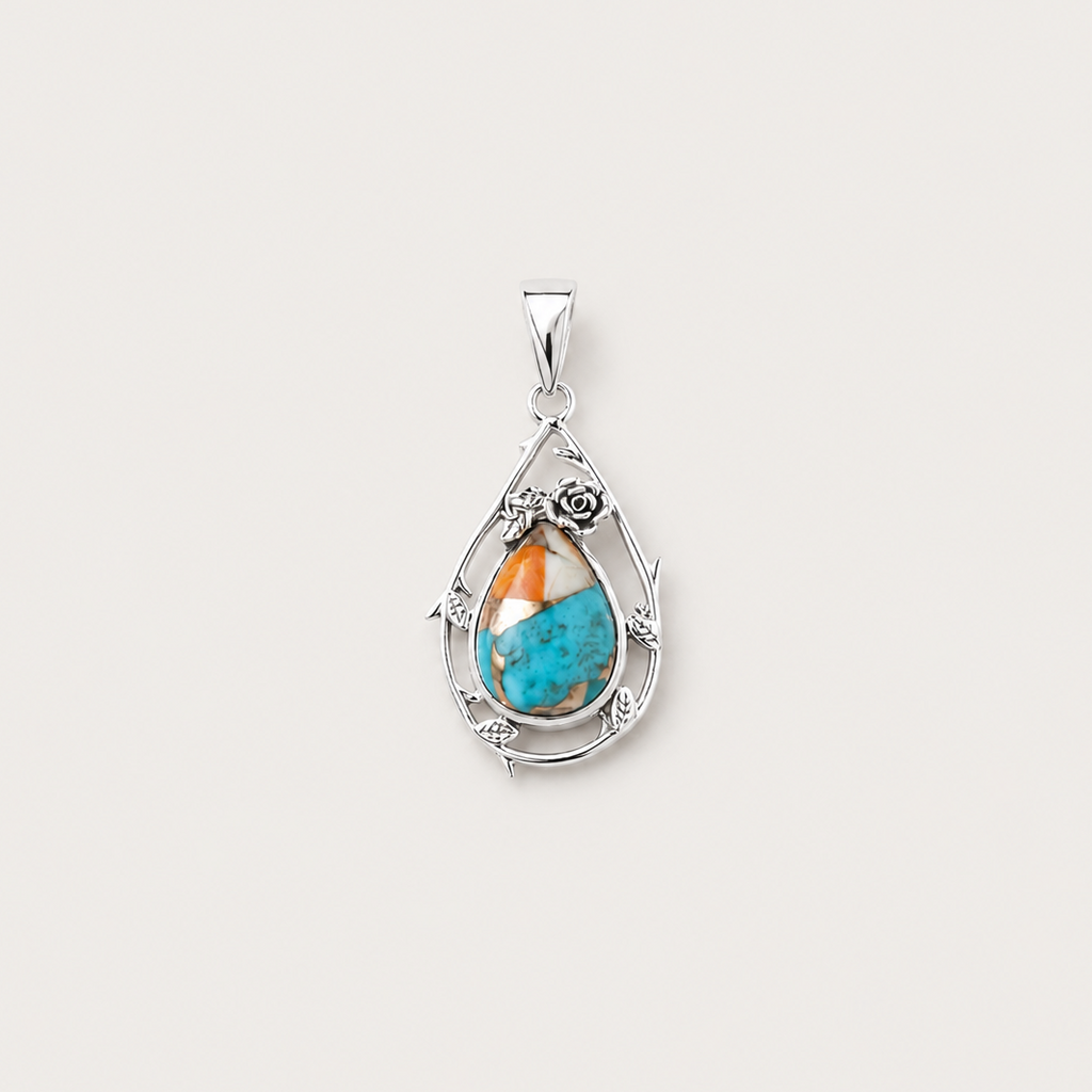 Silver pendant with a turquoise stone on a white background