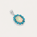Pendant with a central opal stone surrounded by turquoise stones on a light gray background