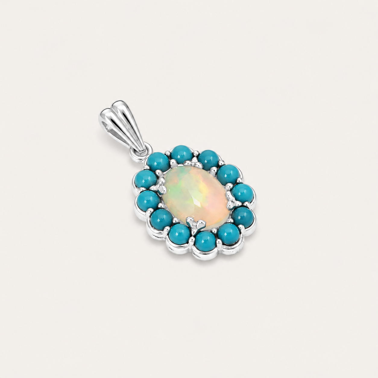 Pendant with a central opal stone surrounded by turquoise stones on a light gray background
