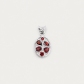 Silver pendant with red gemstones on a white background
